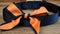 an orange and blue bow tie on a blue collared collared collared collared collared collared collared collared collared collared