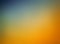 Orange blue and gold background blur, gradient blue sky blurred into orange clouds with smooth texture