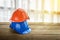 orange, blue hard safety helmet construction hat for safety project of workman as engineer or worker