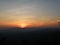 Orange and blue sunset afterglow over the silhouette of mountain range