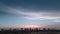 Orange blue sunset and silhouettes of coastal high-rise buildings on the coast of Naples in Florida. Wide drone shot