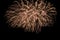 Orange blurred firework lights on black sky background