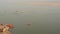 Orange Boats Sailing On The Trans-Boundary River Of Ganges Located In Varanasi, Uttar Pradesh, Indi