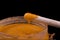 Orange body scrub apricot pits wooden stick