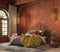 Orange boho style bedroom interior with armchair, dresser and decor.