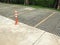 Orange bollard/traffic pole represent no parking