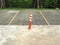 Orange bollard/traffic pole represent no parking