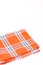 Orange brand new kitchen dishtowel over white background