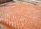 Orange brick paving stones in construction process