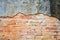 Orange brick wall cracked cement Old , vintage brick background.