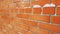 Orange brick wall with snow in snowy day