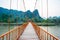 Orange bridge over song river in Vang Vieng, Laos