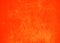 Orange bright abstract background texture with scratches and spray paint. Blank background design banner.