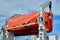 Orange bright lifeboat on the ferry