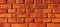 Orange brown damaged rustic grunge brick wall / masonry / brickwork texture background banner wallpaper template