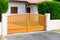 Orange brown street home door aluminum gate slats portal of suburb house