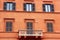 Orange building with balcony