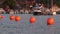 Orange buoys in the harbor