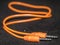 Orange cable for connection of electronic devices.