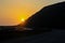 Orange California Coast Sunset Creates Land Silhouette