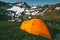 Orange camping tent in mountains landscape Travel Lifestyle
