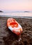 Orange canoe on the beach