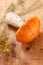 Orange-cap boletus mushroom on aspen wooden board