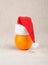 Orange in cap of Santa Claus