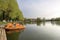 Orange catamarans are moored in a row on the pier