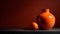 Orange ceramic vase with grapefruit on dark background. Copy space.