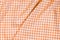 Orange checkered fabric tablecloth