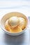 Orange and cheese ice creams in bowl