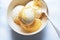 Orange and cheese ice creams in bowl