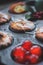 Orange and cherry muffins in muffin baking pan