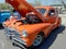 orange Chevrolet Fleetmaster 1947 coupe classic car. Open hood showing engine. Expo Fierros 2021