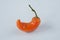 Orange chili on white background. Pepper