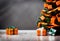 orange christmas gift parcels under a tree decorated with matching baubles