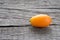 Orange citrus fruit kumquat on wood