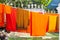 Orange clad robes drying outside