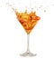 Orange cocktail splashing in martini glass