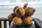 Orange coconuts on a wooden terrace`s corner