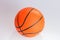 Orange color Basketball over white background