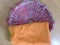 Orange color cotton cloth in changair for keeping roti or chapati or paratha warm