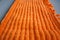 Orange color microfiber cleaning material texture, closeup shoot.