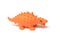 orange color plastic dinosaur toy on white background