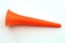 A orange color plastic vuvuzela horn isolated on white background
