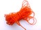orange colored rope with a white background
