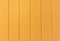 Orange colored vertical wooden planks background texture