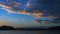 Orange coloured stratucumulus cloud, sunset seascape.