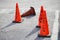 Orange cone (pylon) with no parking, slow and caution sign